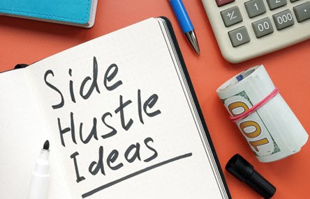 a notebook showing the words side hustle ideas